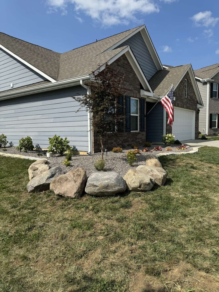 Boulder retaining wall Plants Trees Stone edging Decorative rock
